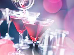 Two red cocktails in martini glasses