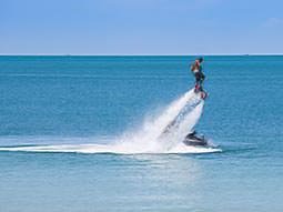 A man flyboarding over the ocean
