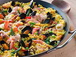 Paella in a black pot