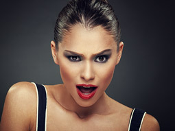 Close up of a blonde woman shouting