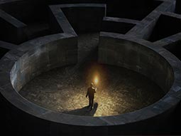 A man holding a torch in a maze