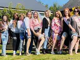 A group of women wearing garters, outside