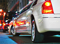 A close up of a white limo