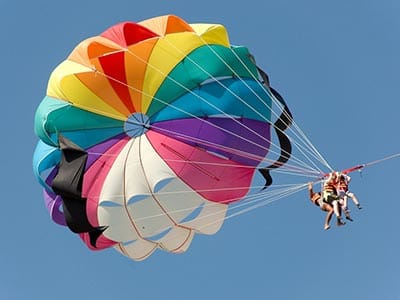 Image of two people parasailing 