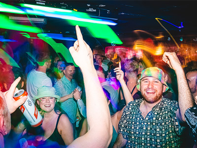 A group of people dancing and having fun at Sing City