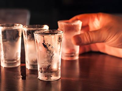 Image of four cold shots of vodka