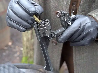 A silhouette of a woman holding a gun to the air