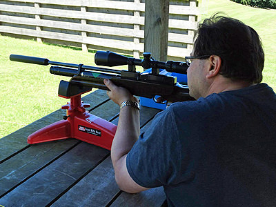 Big man aiming his rifle