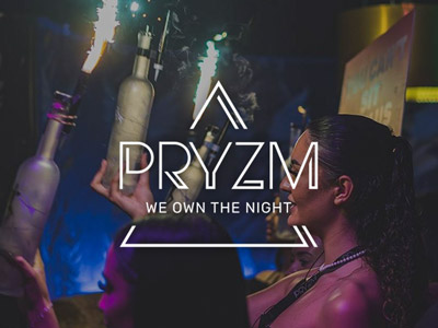 Someone carrying through alcohol with sparklers coming out of them at PRYZM