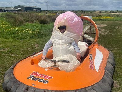 Someone in a willy costume driving a hovercraft with Hover Force