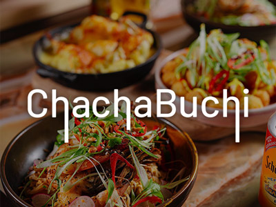 Three colourful food dishes on a wooden board at ChachaBuchi in Newcastle