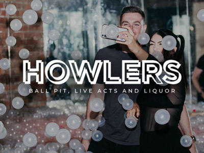 Two partygoers taking a selfie in the ballpit at Howlers Newcastle.