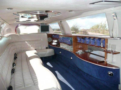 The inside of a hummer airport transfer in Valencia with white leather interior