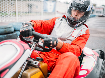Someone in a go kart driving around a track in Lisbon
