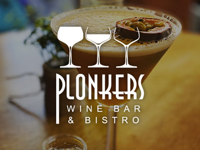 A close up of a pornstar martini cocktail with the Plonkers logo overlayed at Plonkers in York