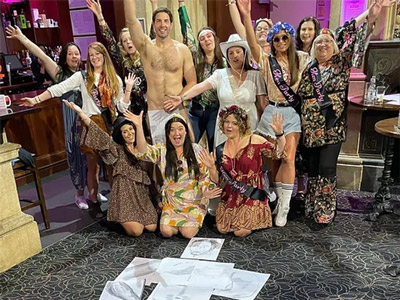 A hen group with a naked man at a nude life drawing class in Bristol