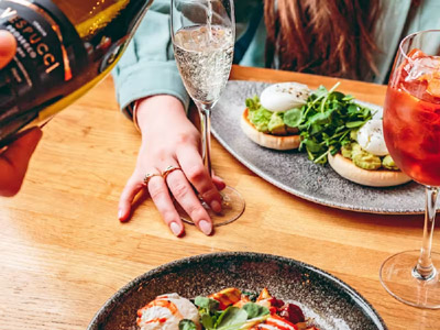 Drinks being poured and meals on the table at Banyan