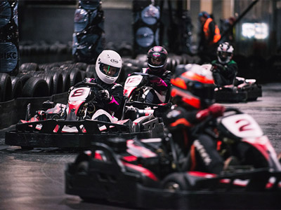 People racing on a track at TeamSport Karting in Newcastle
