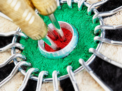 Three darts in a bullseye target at interactive darts