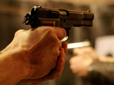 Someone aiming a gun at their target in Budapest