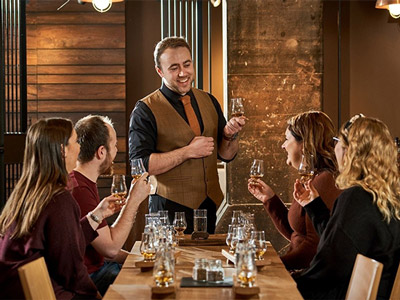 A group of people tasting and testing whisky at The Scotch Whisky Experience in Edinburgh