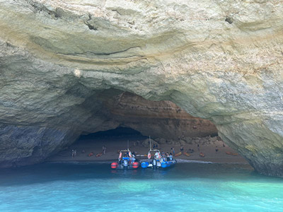 Two boats entering a cave on the Benagil Cave Boat Tour in Algarve