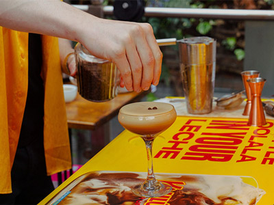 Image of cocktails being made and poured through a cocktail shaker