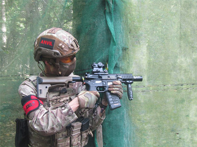 Someone aiming an airsoft gun at their target in Southampton 