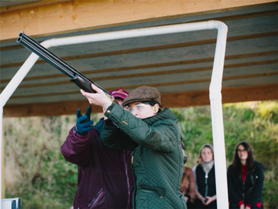 Lady holding a rifle