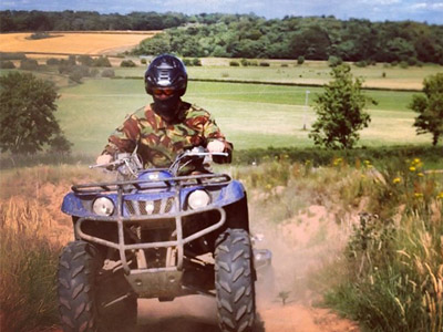 Someone on a quad bike driving down a dirt track in Chester