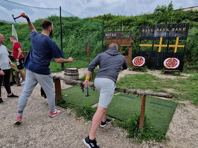 A group of people throwing axes at a target at Country Games in Split 