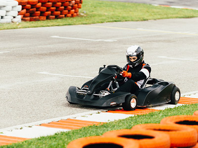 Someone in a go kart going round an outdoor track in Split