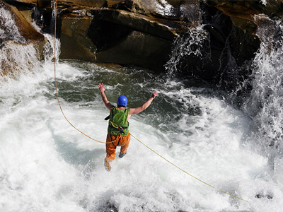 Someone jumping into water as part of a canyoning activity in Split