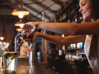 Someone making and pouring a cocktail at a class in Split