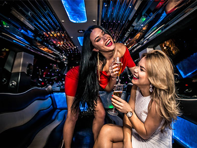 Two girls having fun in a party bus in Split