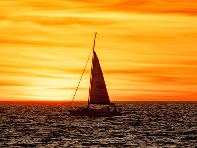 A cruise riding out into the sunset in Lisbon