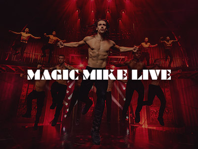 A group of topless men performing with the Magic Mike logo overlayed