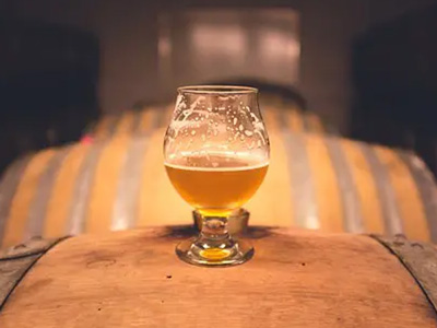 Glass of beer on top of a keg at St Dominic's Brewery in Newcastle