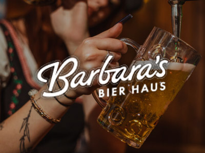 A bartender pouring a beer at Barbara's Bier Haus