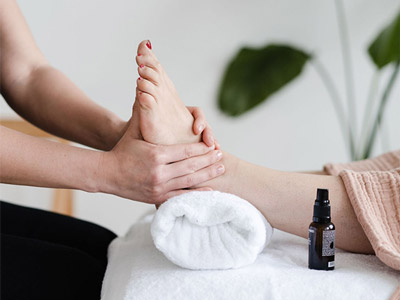 Someone receiving a foot massage
