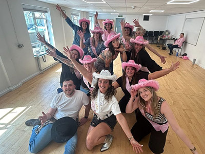 A group of people with cowboy hats on at Sashay Dance