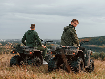 Two men on quadbikes