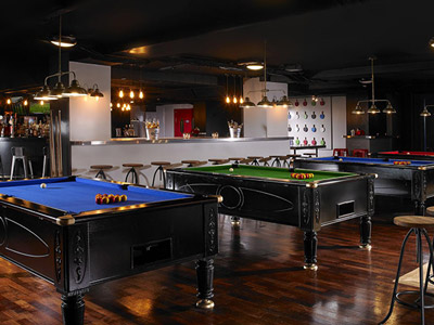 A row of pool tables at Buskers On The Ball