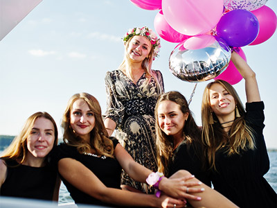 A hen group celebrating on a party boat