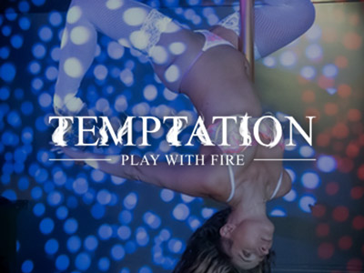 A women dancing around a pole at Club Temptation