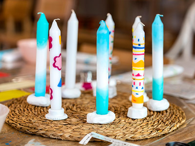 A selection of decorated candles at a Candle Painting Workshop