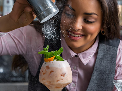 A bartender making a cocktail