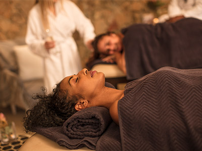 A woman laid down relaxing at a spa experience