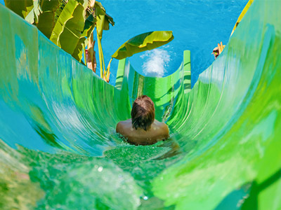 Someone going down a waterslide at a waterpark