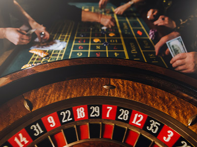A close up of a roulette wheel at a casino 